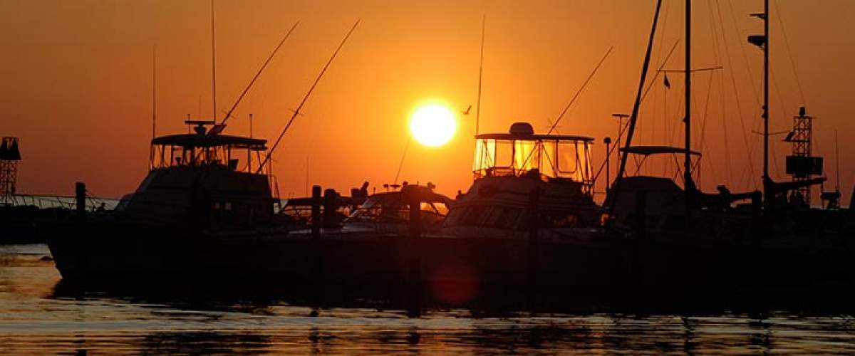 ocean sunset boats