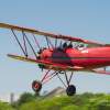red biplane in the air